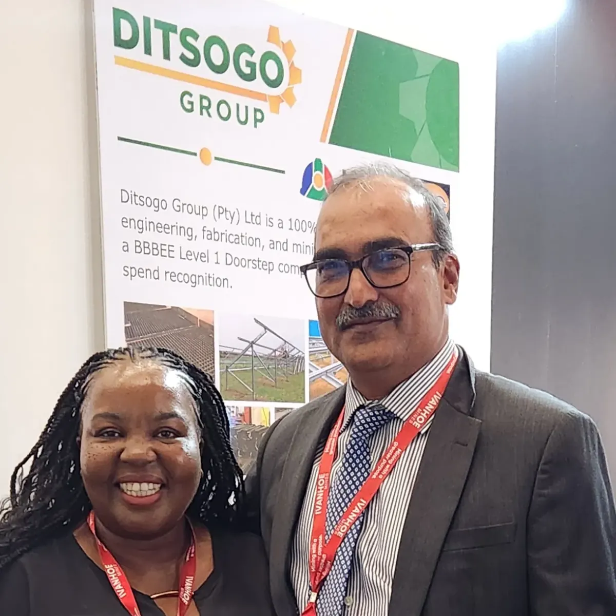 A delegate meeting the Ditsogo Group team at the company stand during Mining Indaba